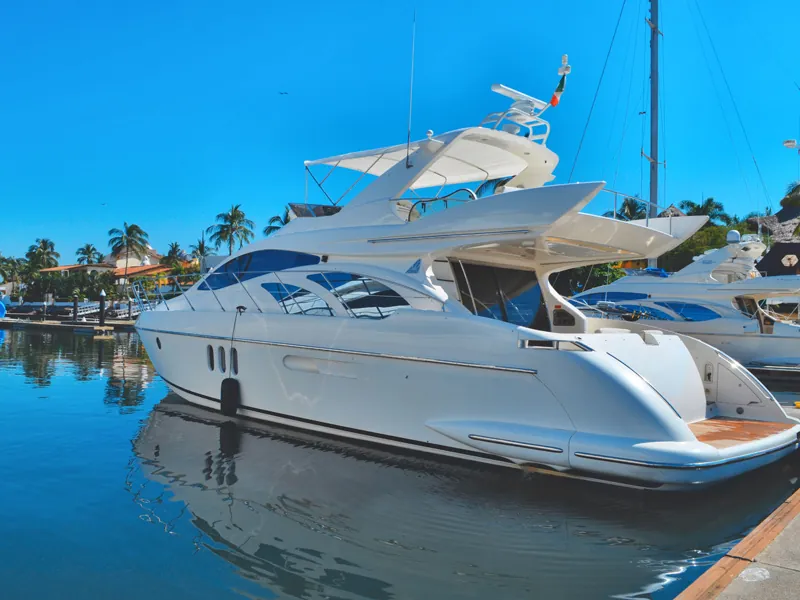 White Azimut yacht moored in Marina Vallarta