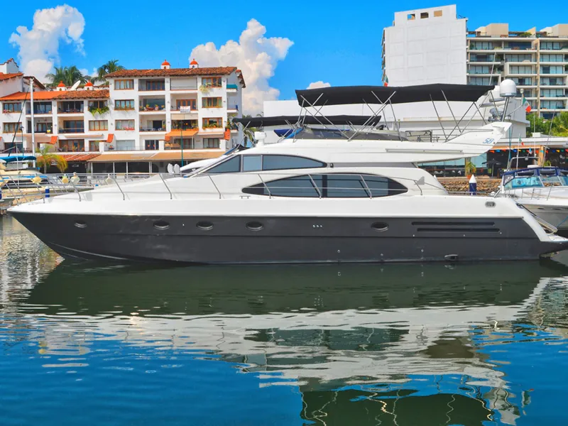 Yacht docked in front of Marina Vallarta condos